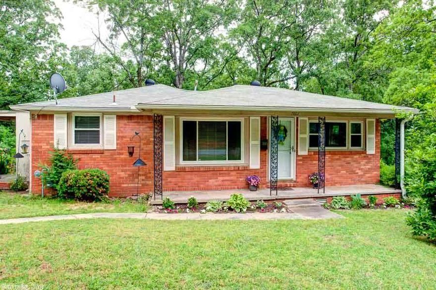 Updated Leawood home with all of the conveniences of Midtown. Shopping, dining and access to the interstate just minutes away. Kitchen opens to a large dining room and includes clean, white cabinets, new corian counter tops and stainless appliances. Hardwood floors throughout. Updated bathroom. Home sits on a large corner lot. Carport and an additional parking pad. **Agents see remarks**