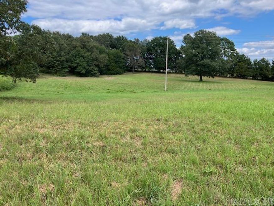 6.5 Acres M/L with Highway 166S frontage. This land has a nice pond, a tractor barn, is mostly open and has several good building locations. Power runs across the property and rural water is available along the road. Property has been surveyed. Build your dream home today!