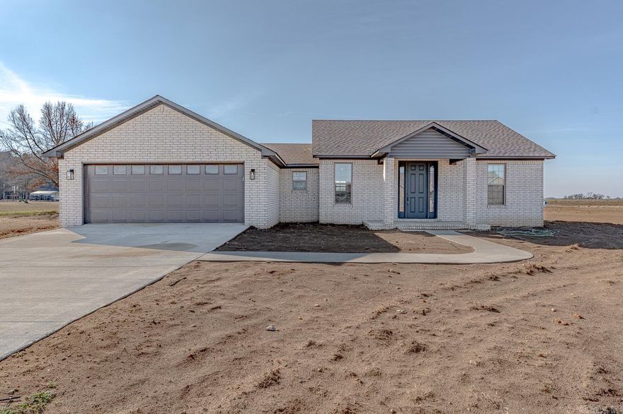 Welcome to Market 1599 Fourth St, Lake City, Arkansas, in the Riverside School District. This new construction is ready for new owners with 3 bedrooms and 2.5 baths, offering 1,599 square feet of heated and cooled living space on a surveyed 0.48-acre lot. The open kitchen features stainless appliances, custom cabinets, and solid-surface countertops, plus a large walk-in pantry for extra storage. The primary suite features a walk-in shower, soaking tub, and a huge walk-in closet. The split floor plan includes a large laundry room and an additional half bath for added convenience. Enjoy outdoor living on the covered back porch overlooking the spacious yard. Additional highlights include a 75-foot concrete driveway with a 14x20 turnaround for ample parking and an energy-efficient gas tankless water heater. Zero-down financing is available for qualified buyers. Call today to schedule your tour.