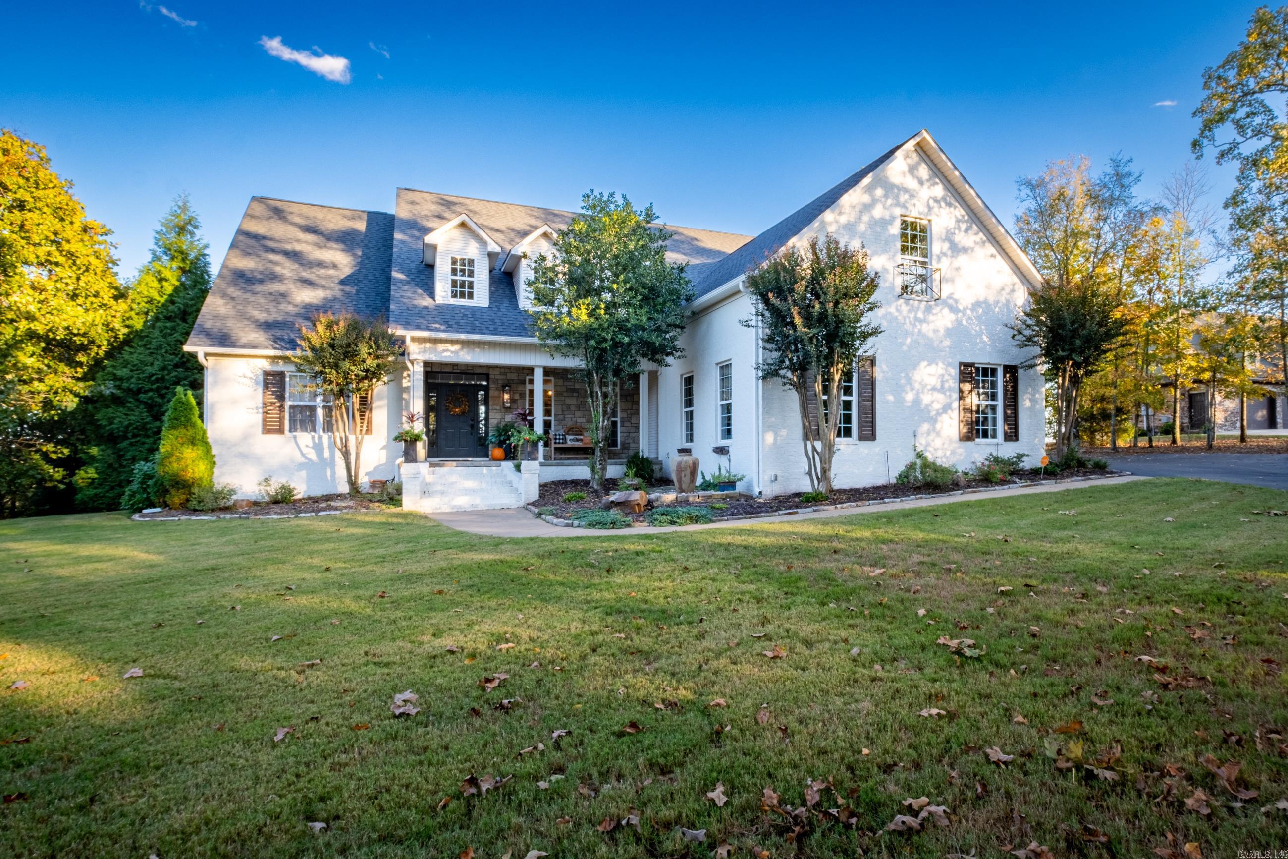 Picturesque, rare private property with breath taking views nestled on 5.27 acres on Round Mountain. This painted brick beauty is an entertainers dream complete with inground pool, covered outdoor pavillion/fireplace/TV/grill area, converted garage golf simulator, oversized game room. Open living with 2 story ceiling, large windows along back to capture the view and light. Beautiful stone fireplace, hardwoods and built-ins in great room. Versatile floor plan - keeping room off kitchen, loft/office, 3 optional dining areas. Breakfast bar and island in kitchen. Hardwoods in master suite - completely renovated bath, soaker tub, tile shower. Utility sink in laundry and convenient laundry chute. New roof and gutters in 2023 with 30 year shingles and 10 year warranty. Golf simulator room has mini-split air system and is not included in square footage. Simulator includes computer, software, simulator, projector, impact hitting mat and impact screen. Seller will convey simulator with acceptable offer. Low Conway Corp utilities. Serenity at it's finest!