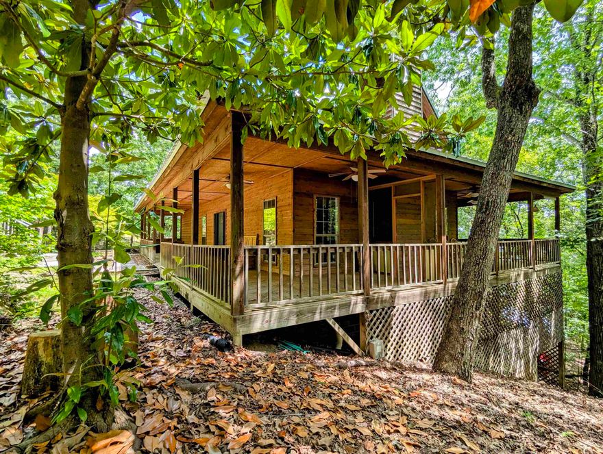 Charming Lakefront Home on Greers Ferry Lake! This three bedroom cabin features a wrap around porch, lots of glass, large decks, easy walk to the water, bonus bunk closet, and very good privacy. Lots to love here!