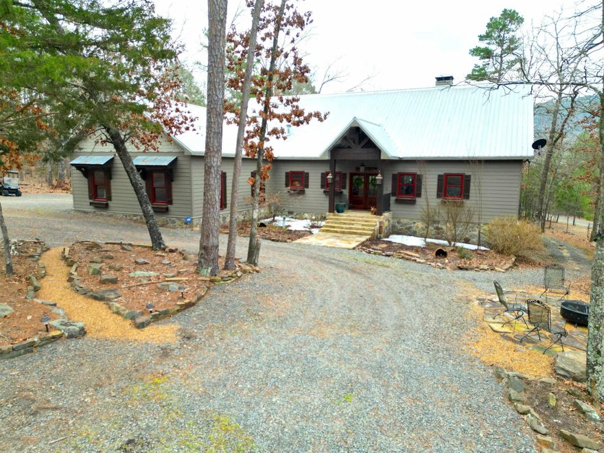 Modern living with a classic cabin vibe!  Located in beautiful Primrose Creek gated Subdivision.  Beautiful and private setting with access to the spectacular pool and gathering area, community boat dock and launch on the famous trout waters of the Little Red River, picnic and fire pit areas, warm water fishing lake and lots of green space.  HUGE screened room with it's own massive fireplace, deck with greenhouse and plenty of room for outdoor entertaining.  Chef's kitchen with 6 burner gas fired KitchenAid range and double oven.  Upstairs loft bunk room, classic pine plank floors, shiplap walls and tongue and groove ceilings.  Old-school craftsmanship wedded with modern comforts and livability define this home!