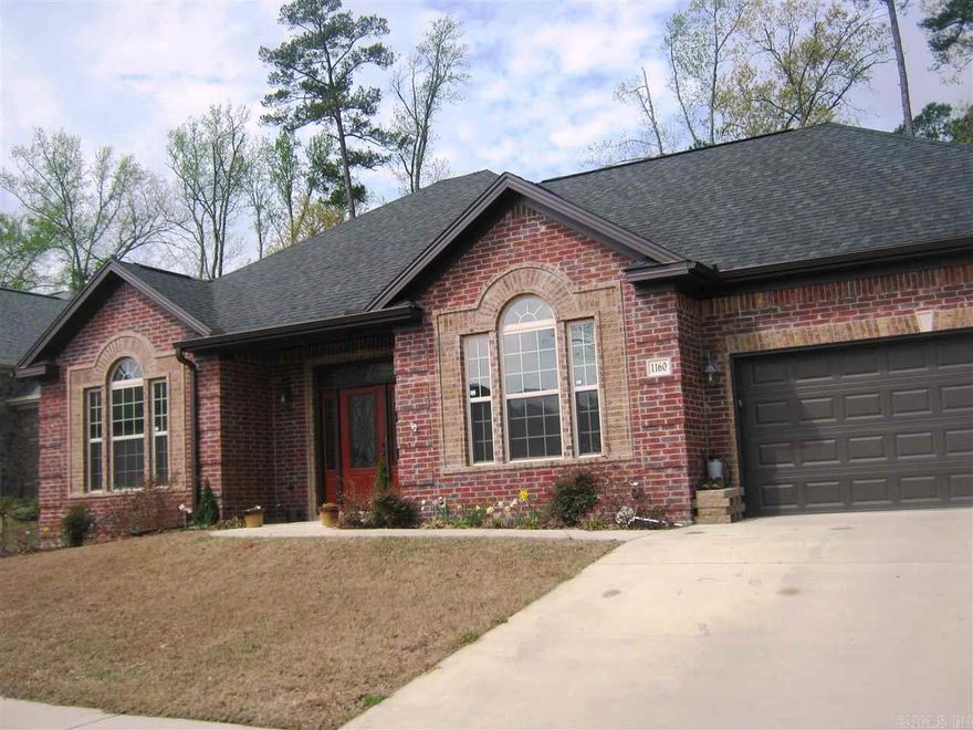 This home has hardwoods in main living areas, tile in wet areas, carpet in bedrooms.  Kitchen has custom stained cabinets with stainless steel appliances, with pantry.  Kids bedrooms have extra large closets. Master has two vanities, with  separate   shower and tub..  Fenced in backyard . Home has security system.
