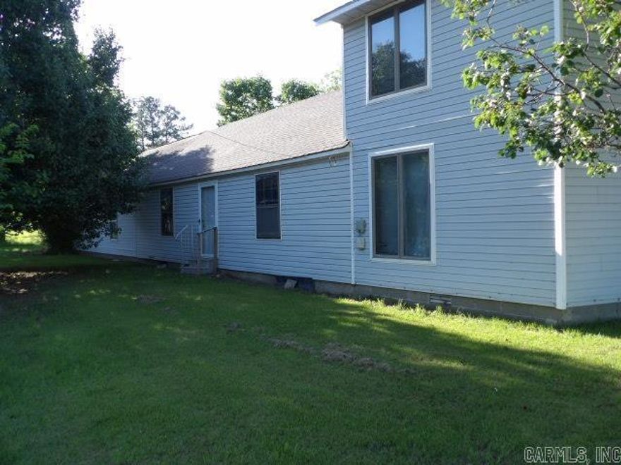 Corner Lot offers flexible options. The main level of the property features multi purpose spaces as well as the primary and secondary bedroom. The upstairs has a landing area and a third bedroom. There is a porch that is enclosed and a secondary living space on the main level