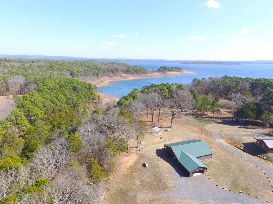 Lovely Lakefront Home on Greers Ferry Lake! This low maintenance four bedroom home features an easy walk to the water, vaulted ceiling, split layout, large windows, metal roof and two car garage. A really wonderful property!