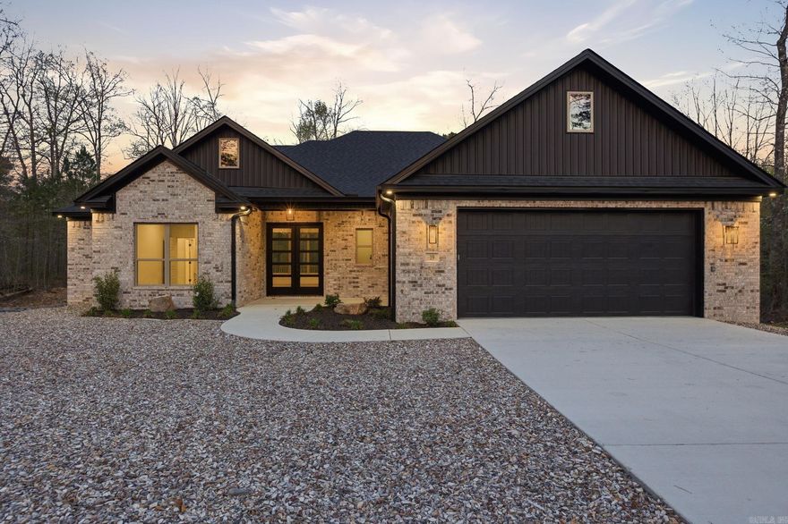 Clean lines. Smart design. Zero wasted space. This beautifully crafted modern home delivers the layout buyers actually want—3 bedrooms, 2 bathrooms, and a seamless flow that feels both open and intentional. The kitchen is the centerpiece, anchored by a spacious walk-in pantry that keeps everything tucked away while the main living areas stay sleek and uncluttered. Just off the garage, a well-designed drop zone makes everyday living effortless—bags, shoes, and life stay organized the moment you walk in. The split-bedroom floor plan offers privacy where it matters most, while the primary suite provides a quiet retreat at the end of the day. Out back, a covered deck extends your living space year-round—perfect for morning coffee, evening unwinding, or hosting without the heat. All of it set on a quiet street in Hot Springs Village, where peaceful surroundings meet an active lifestyle. Modern. Functional. Exactly what today’s buyer is looking for.