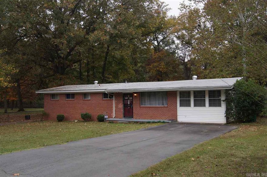 This home sits on nearly half an acre in quiet, low traffic area. There is a large screened-in porch, shed with an overhead door, and a storm shelter. This is home has great potential and with a few updates could be a show place.