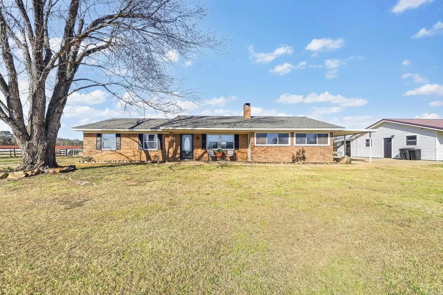 This home has so much to offer for the family that likes to live outside and inside!  The brick home has 1907 square feet with 3 bedrooms and 2 bathrooms, laundry room with a pantry/closet, a large bonus room,  a carport to pull up into when it is raining! The 2-car garage with a connecting bedroom, bathroom, and a large closet sits close to the home. So now for the outside! 14 acres with two chickens houses that could be used for storage or maybe shops! Lots of room! Newly built 13 feet deep in the middle stock pond. Of course you need a barn so it has one closer to the home!  Summer is coming so you need a pool! The inground pool has a very unique entrance and it is heated! An outdoor kitchen is right there.  On the end of the pool there is Cabana with a fire pit!  Oh and a place for your hot tub! A truly must see home!