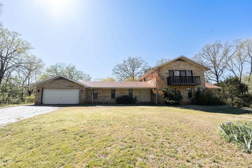 This one-owner, custom-built home offers the rare opportunity to own a peaceful retreat just outside Conway city limits. Nestled on 3.78 acres, this 3,671 sq ft home combines privacy with close-to-town convenience. Inside, you’ll find 6 spacious rooms, ideal for bedrooms, home offices, or creative spaces. With 3.5 bathrooms, comfort and functionality are a priority. The heart of the home is a large recreation room with a full wet bar, perfect for entertaining or relaxing after a busy day.  The home is built with lasting value in mind, featuring timeless stone construction, a gated entry, and its own well. Out back, a 2-bay shed provides extra space for hobbies or storage. The expansive property offers plenty of room to garden, roam, or expand.  Whether you’re an investor looking for a project or a homeowner seeking peace and privacy, this home offers endless potential. Make it your own and enjoy the perfect blend of seclusion and convenience.