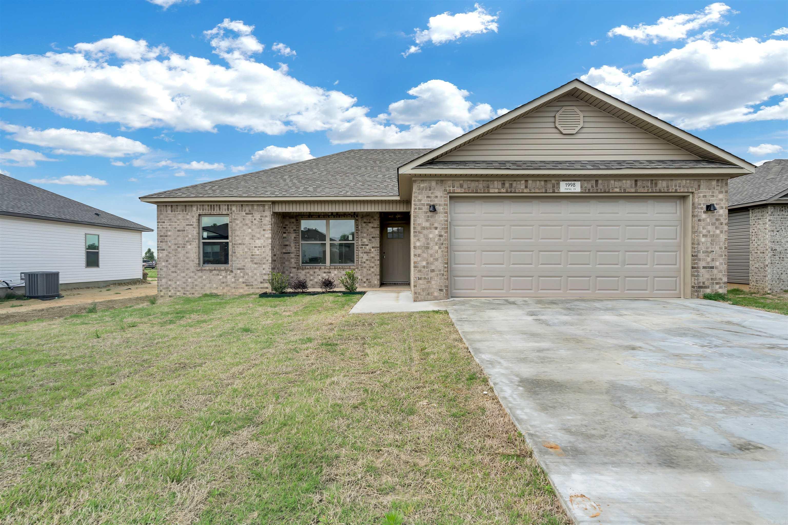 Step into stylish living in the highly desirable Lakewood Landing Subdivision of Lake City, AR! This 1,302 sq ft beauty features bold black shaker cabinets, sleek stainless hardware and fixtures, luxurious drama marble countertops, and upgraded LVP flooring throughout?bringing both comfort and sophistication under one roof. Located in the award-winning Riverside School District, where students can graduate high school with an associate degree, this home offers a true advantage for growing families. Plus, you're just minutes from all the local amenities Lake City has to offer. If you're looking for a home that blends modern finishes with everyday convenience, this is the one! Call me or your favorite agent to schedule a tour today!