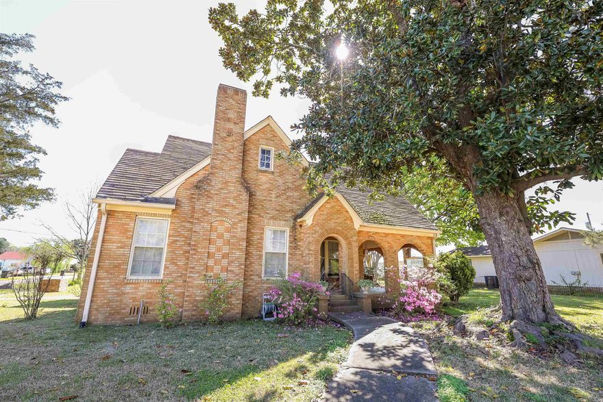 Historic charm welcomes you to a beautifully kept home!  Storybook curb appeal complete with original fence & slate roof, arched details, and covered front porch.  Step inside to see hardwood floors, heightened ceilings, spacious rooms, enhanced with the many tall windows for soft natural light.  The seller has updated many key features over the years including electrical, a bathroom remodel, and so much more!  If you appreciate the quality and unique beauty of vintage builds, this home is just waiting for you!