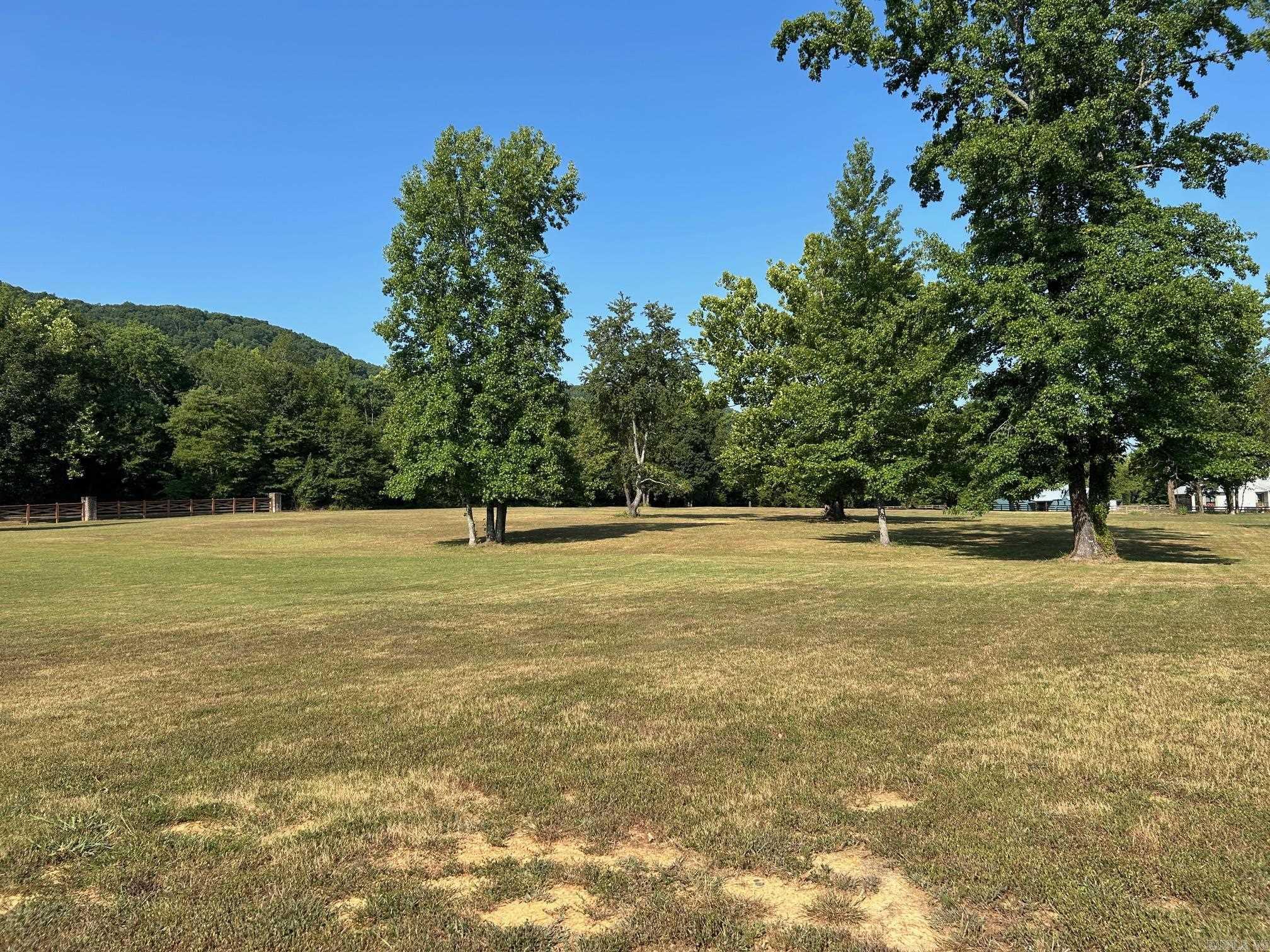 **Premier Lot in Rivers Edge Subdivision** Discover the finest vacant lot in Cleburne County, a rare gem in the prestigious Rivers Edge Subdivision. Close proximity to the Little Red River, this exquisite lot offers unrivaled luxury and natural beauty, perfect for your dream home. Backing up to a lush green area, it ensures privacy and stunning views of Libby Bluff with the soothing sounds of the river just steps away. The subdivision is adjacent to a public launch ramp at Lobo, enjoy world-class fishing and boating on the pristine Little Red River. Rivers Edge redefines upscale living with gated entry for security and exclusivity. Savor premium amenities: a community boat dock for waterfront adventures, a sparkling pool for relaxation, a charming pond, & a clubhouse for gatherings. Utilities—water, high-speed internet, and electric—are conveniently at the road, ready for your custom build. This lot is more than land; it’s a lifestyle of elegance and adventure. With its prime location, unmatched amenities, and serene riverside setting, it stands alone as Cleburne County’s most coveted property. Seize this opportunity to create your legacy in a paradise of luxury & tranquility.