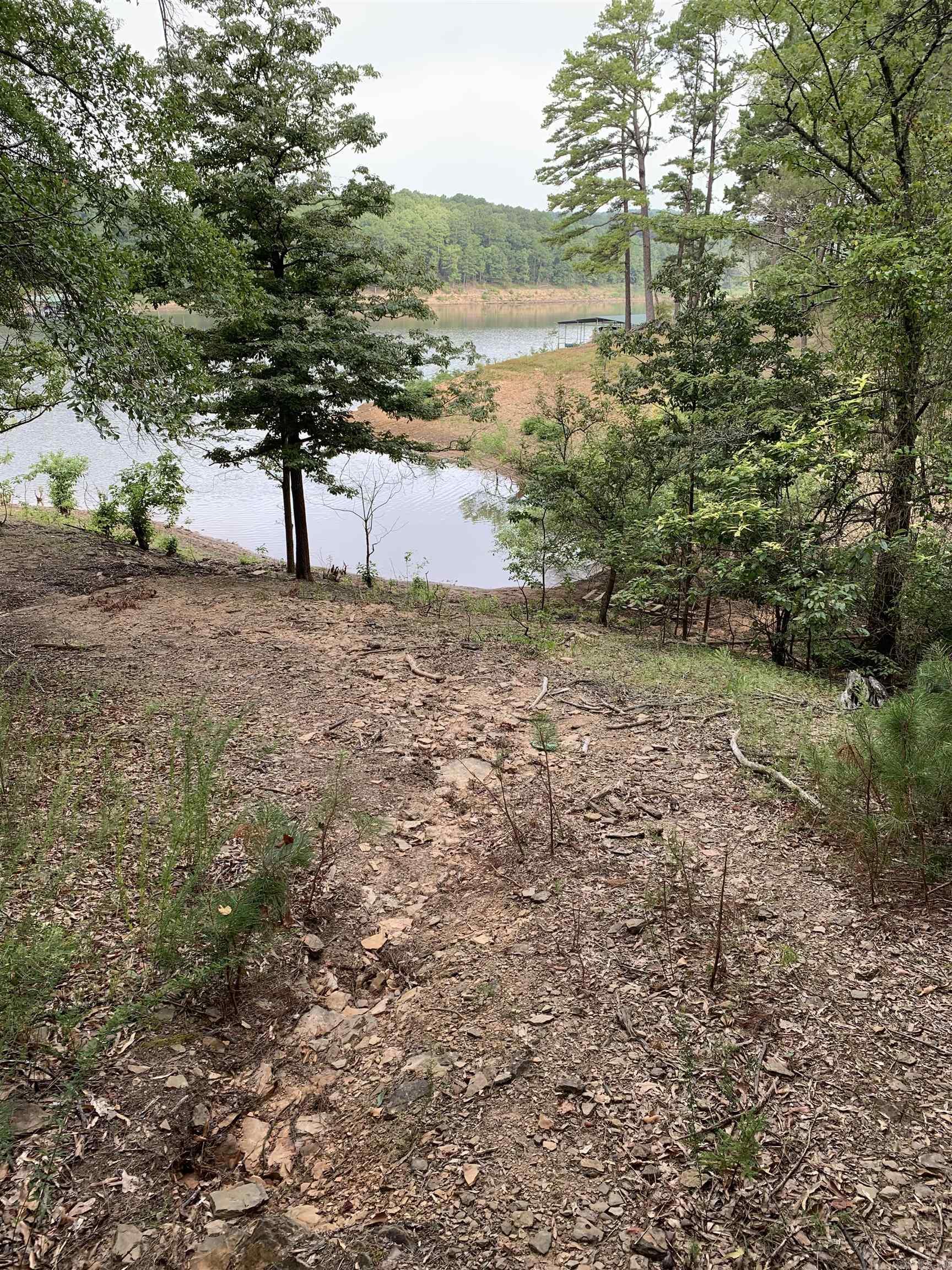 BIG PRICE DROP on the LAKEFRONT LOT!!! Don't miss this rare opportunity to own a beautiful .76-acre lakefront lot on the pristine shores of Greers Ferry Lake. This gently sloping property offers the perfect setting to build your dream home. The lot is ready for construction, with a survey already on file. Whether you're envisioning a weekend getaway, a retirement retreat, or your forever home, this lot provides the space and scenery to make it happen. Enjoy peace, privacy, and proximity to the lake, with ample room for outdoor living, entertaining, or simply relaxing in natureās beauty. Your lakefront lifestyle starts hereācome see the potential for yourself!