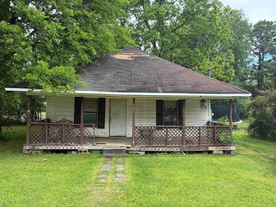 Looking for a Project in a central location?  Nice covered front porch. Vinyl siding. Corner lot. In need of updating and restoration.  No seller disclosure, priced as-is.