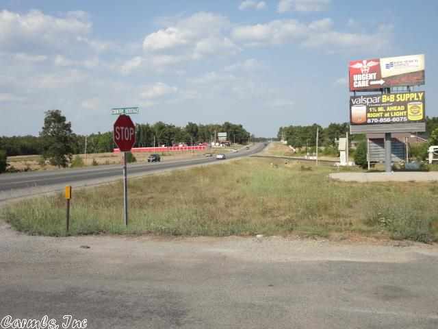 Large commercial lot. Great location between Ash Flat and Highland. Heavily traveled 4 lane highway. City water/sewer available. Loads of opportunity. Own a piece of Ozark Foothills commercial property. Build your own business.