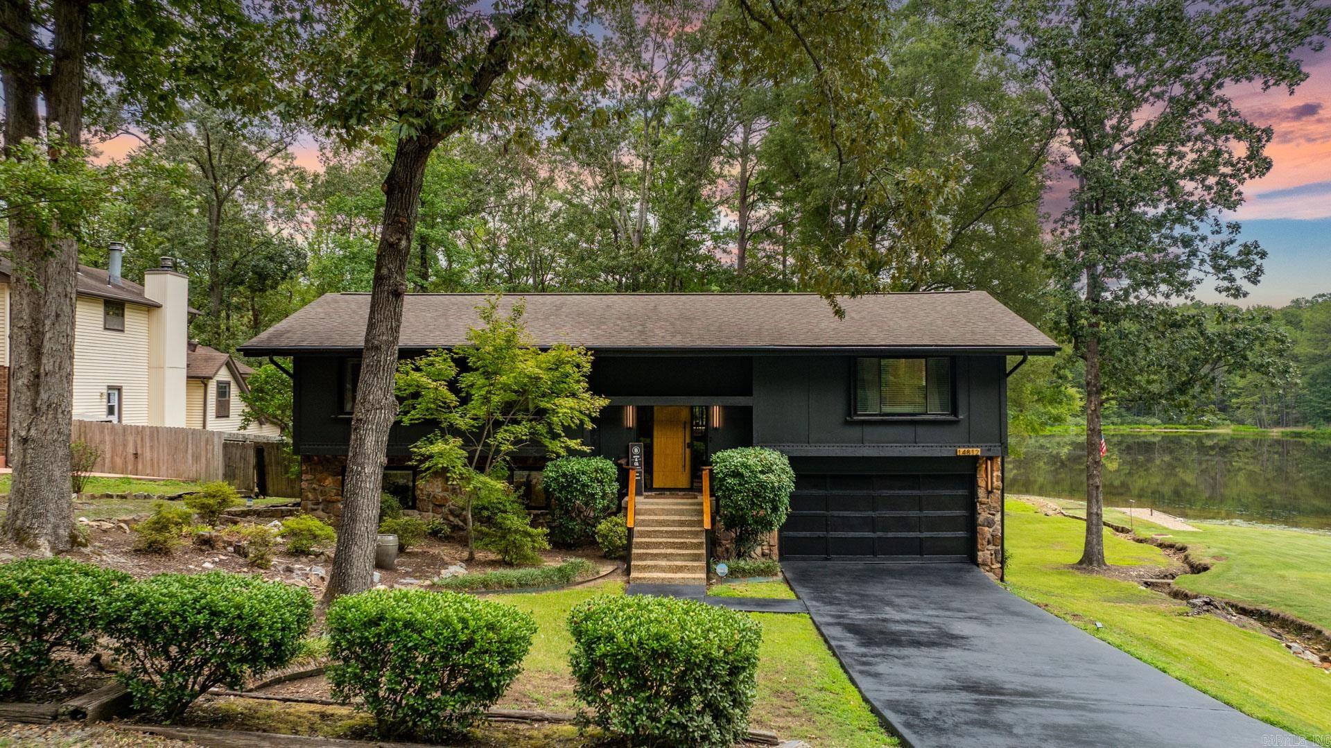 Welcome to this beautifully updated home offering modern style and serene lakeside views! Featuring 3 bedrooms and 2.5 baths plus bonus/flex space, this residence is set on the neighborhood lake in the desirable West Little Rock: Spring Valley Manor community. The main level boasts an open living and dining area with plenty of natural light, where you can find frequent deer sightings, adding to the natural charm of the home. The CafƩ GE refrigerator is included in the streamlined, spacious kitchen. The versatile layout includes a downstairs office/flex space, ideal for remote work or hobbies with the convenient half bath. The lower level also offers the laundry space. Enjoy direct lake access with a shared dock perfect for kayaking, paddle boarding, swimming, and recreation, a rare find in West Little Rock. With its blend of modern updates and outdoor lifestyle, this property is move-in ready and waiting for its next owner. Agents see documents for all of the upgrades!