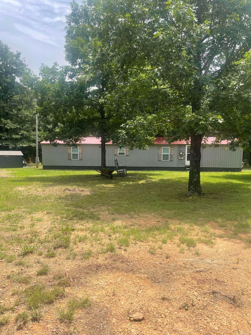 This charming home sets on 1.21 acres.  The entire home has recently been remodeled. It has lament flooring through out and tile in the bathroom. New windows and a 3 1/2 ton Mini Split. You can relax on the back porch and enjoy nature.  Lake access to the Middle Fork of Greers Ferry Lake is only a short distance away. This property has two outside storage buildings. (Bonded Title has been applied For.)