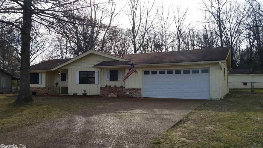 ******NEW PAINT AND CARPET COMING SOON*****This large 3 bedroom, 2 bath home has plenty of room for entertaining and family living. With 2 large living areas, a separate dining room, sunroom and library/office space, there is a room for everything and everyone! Large fenced in back yard and 20X 24 workshop just blocks from Westside Elementary.