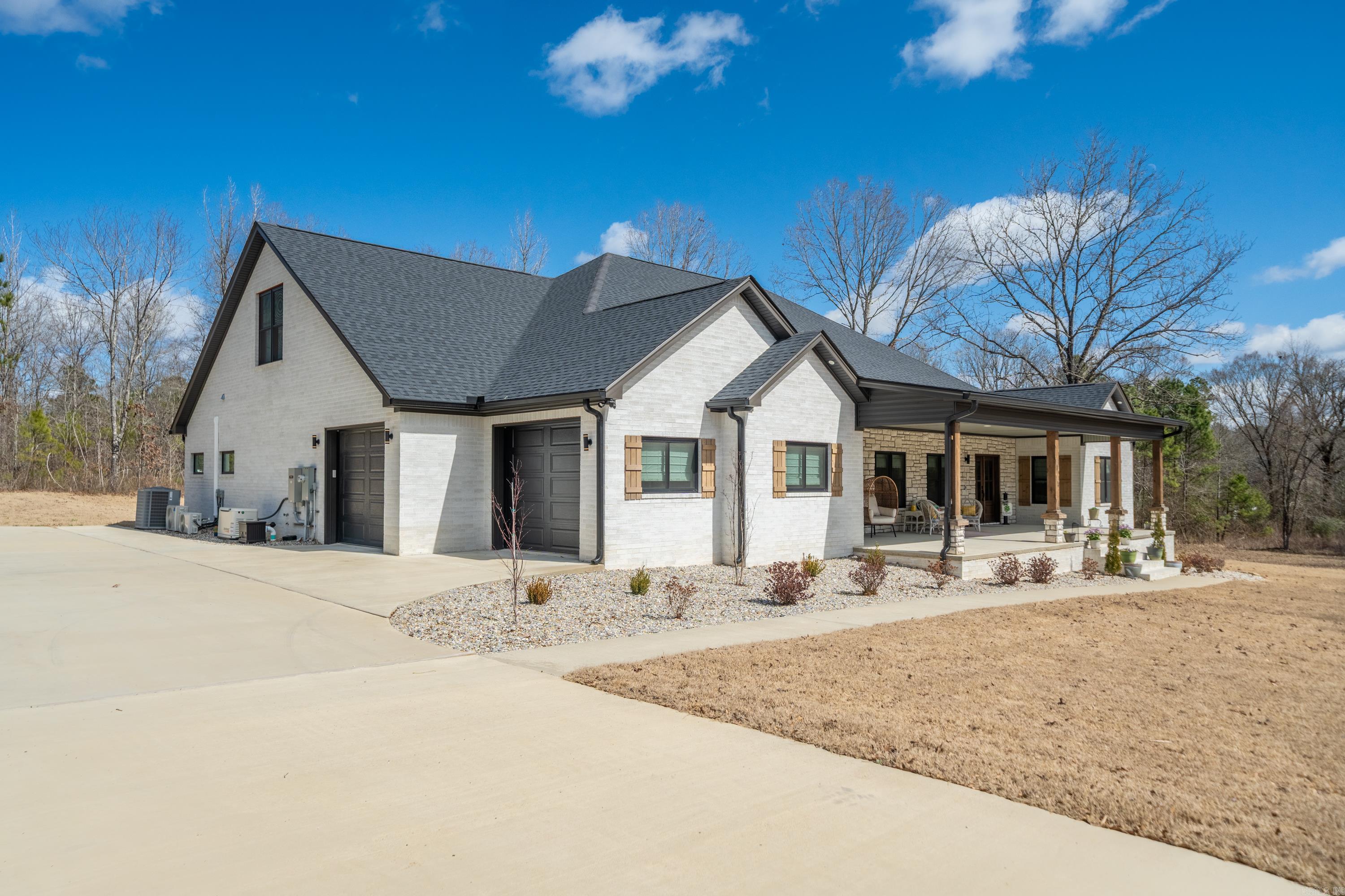Tucked away in the peaceful woodlands of Bismarck, AR, this charming country residence offers a flawless combination of elegance and serenity. Set on generous acreage, this property boasts a magnificent in-ground, heated, accessible pool perfect for year-round relaxation. The outdoor kitchen is a culinary enthusiast's paradise, featuring a sink, fish cooker, grill, Blackstone griddle, and refrigerator—ideal for hosting with flair. Enjoy peace of mind with a Generac generator, a complete sprinkler system, and no exterior upkeep thanks to meticulous landscaping. Inside, discover tons of built-ins for storage, a butler's pantry, two refrigerators, an ice machine, and spacious, open living areas. The upstairs and glass patio room are equipped with separate heating and air for ultimate comfort. With large porches to take in the scenic views, this home is fully electric indoors and gas outdoors, offering the best of both worlds. This is a true retreat—a perfect blend of modern convenience and country charm.
