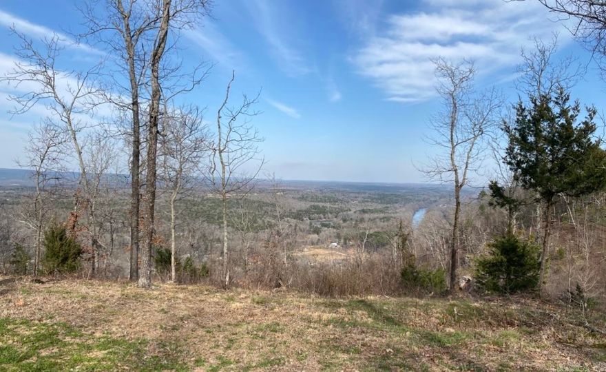 Escape to your own private sanctuary with this stunning 11.3-acre wooded parcel, a mere stone's throw from the charming town of Heber Springs and the shimmering waters of Greers Ferry Lake. Imagine crafting your dream home amidst this tranquil, natural haven, where breathtaking panoramic vistas unfold before you. Prepare to be mesmerized by the sweeping valley views, a visual masterpiece showcasing the iconic Sugarloaf Mountain, the impressive Greers Ferry Dam, and the meandering Little Red River. Words and pictures simply cannot capture the sheer majesty of this landscape; it's an experience that demands to be witnessed firsthand. This is more than just land; it's an invitation to embrace a life of serenity and unparalleled beauty. A truly rare opportunity: this exceptional property, lovingly held by its owners since 1980 and 1989 respectively, is now on the market for the first time in decades. Don't miss your chance to own a piece of this legacy and create your own story in this idyllic setting.