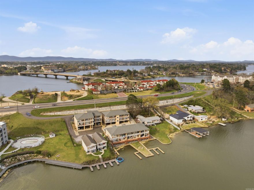 If your idea of the perfect lake place includes wide water views, easy living, and the option to generate income when you’re not using it this one checks the boxes.  This third-floor condo in Central Terrace offers beautiful views of Lake Hamilton’s main channel from both the living room and primary bedroom. The open layout creates a comfortable space for everyday living or hosting friends at the lake, and the fireplace adds a cozy touch during cooler months.  Step outside onto the spacious deck where mornings start with coffee and evenings end with sunset views over the water. Whether you’re looking for a weekend getaway, a low-maintenance lake home, or a property with strong short-term rental potential, this condo offers flexibility.  Being sold fully furnished, including outdoor furniture. It’s ready to enjoy or rent right away. One covered parking space that can fit two cars and a storage room add convenience, and the location puts you just minutes from restaurants, shopping, and everything Hot Springs has to offer.