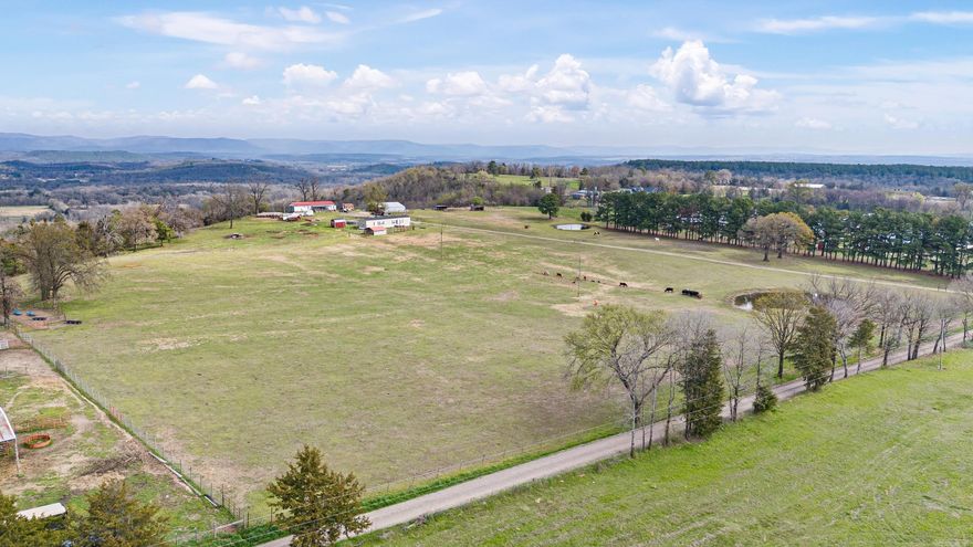 Escape to rural living with this stunning farm nestled in the town of Hartman, AR. Boasting 46 acres of fenced pastureland and wooded areas ideal for hunting and farming, this property offers a blend of serenity and functionality. Whether you're seeking space for livestock grazing or outdoor recreation, this property provides the canvas for your dreams. With two mobile homes allows for accommodating guests, family, or tenants with ease. The Multi-Use Barn embraces the potential of the spacious barn, suitable for a variety of purposes. Whether you envision housing horses, cattle, or storing equipment, this versatile structure adapts to your needs. Take advantage of its functionality while soaking in the breathtaking views of the surrounding landscape. Don't miss this Opportunity!