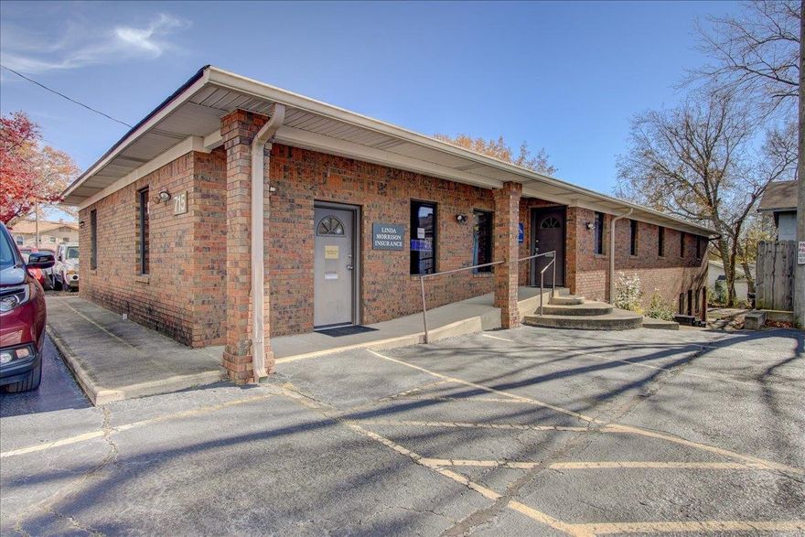 COMMERCIAL OFFICE BUILDING- 2 Suite Building- 715A and 715B.  Brick building with a new roof in Aug 2023. Handicap accessible with approx. 23 parking spaces.  Suite B (vacant) hosts 6 offices, a reception area, a conference room/library, a breakroom/kitchen, and 2 half baths. Suite A is currently occupied by a Insurance agent(tenant). Suite A features an office and 1/2 bath. There is an additional office space/storage room downstairs with a separate entrance.   Ideal for a CPA firm, Attorney's office, or any small business office. Great visibility and easy access!