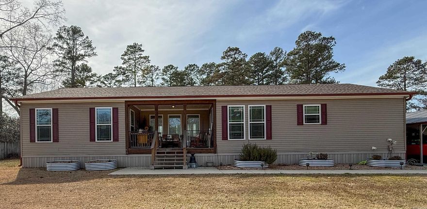 Welcome to 127 Madden Lane, a beautifully maintained 3-bedroom, 2-bath home offering 1,820 square feet of comfortable living space on a spacious 0.68-acre lot. Built in 2022, this modular home combines modern construction with a functional, open layout designed for everyday living.  Inside, you’ll find a bright and inviting interior with generous living areas and a well-appointed kitchen, and all appliances convey, making this home truly move-in ready. The primary suite offers a private retreat, while the additional bedrooms provide flexibility for family, guests, or a home office.  Enjoy outdoor living from the welcoming front porch or entertain and relax on the back deck overlooking the fenced backyard, perfect for pets, play, or gatherings. The property also features a 2-car carport with an attached storage building, also built in 2022, providing ample space for parking and storage.   With modern amenities, plenty of outdoor space, and thoughtful extras, this property offers the best of country-style living with the convenience of newer construction. Don’t miss your opportunity to make 127 Madden Lane your next home!