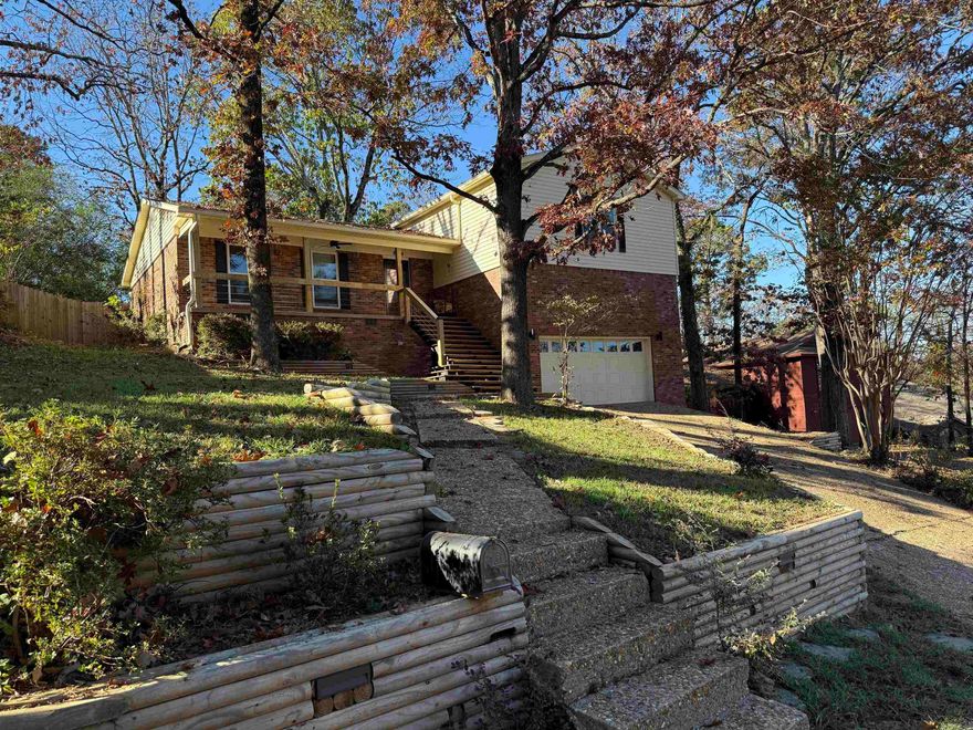 Welcome to this inviting split-level home on Boulder Lane offering 4 bedrooms, 2.5 baths, and 2,166 sq ft of comfortable living space. All bedrooms are located upstairs, including the spacious primary suite with two walk-in closets and an updated bath featuring a walk-in shower. The home has been freshly painted and showcases two living areas, a formal dining room, and a breakfast area for versatile entertaining. The kitchen is equipped with solid granite countertops, a new dishwasher, a gas cooktop and oven, and gleaming hardwood floors. The lower level includes a large second living area with tile floors, counter space, storage, an extra refrigerator, and a fireplace with gas starter, with direct access to the new back deck. Bathrooms are finished with tile, and additional highlights include a two-car garage, Sits on 1/3 of an acre tree-filled yard, and new deck,  railing and extra landscaping in the front, making this home both welcoming and functional.