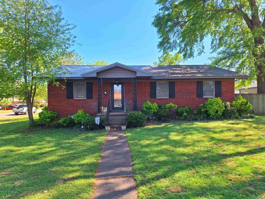 Don't miss this 3 bedroom 2 bath home with two oversized living areas and additional 22x28 shop with electricity! Kitchen has been fully updated. Crown molding and original hardwood floors throughout. Home sits on a large corner lot with fenced back yard. Carport has additional storage room with electric plus additional floored attic storage. Call today to take a look!