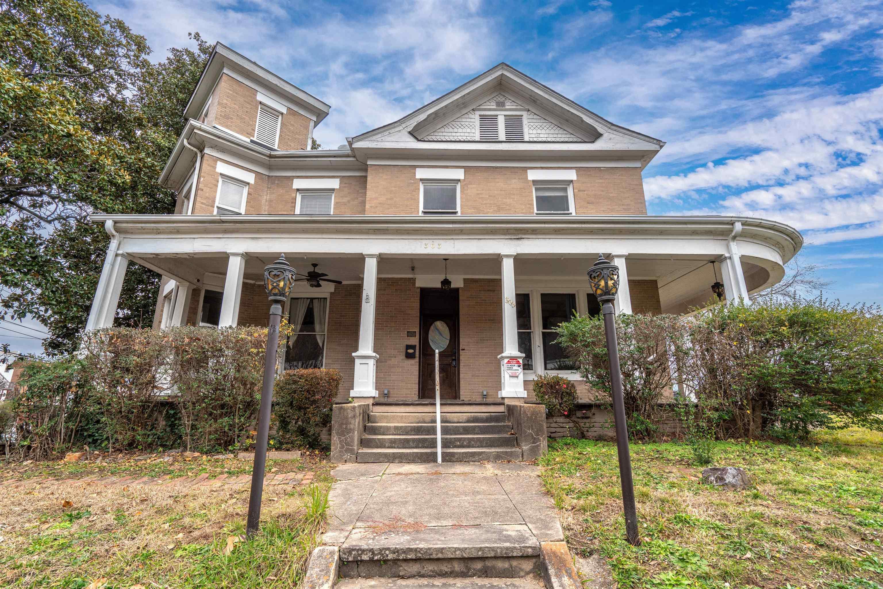 ATTENTION INVESTORS! Step into history with enchanting, one-of-a-kind home nestled in the heart of downtown Hot Springs Historic District. A true gem, this timeless 1908 property offers a world of possibilities for the VISIONARY INVESTOR. Imagine transforming this captivating space into a Boutique Hotel, bed-and-breakfast, an elegant vacations retreat, or a luxurious long term rental. The charm of yesteryear meets modern potential, making it an exquisite backdrop for bridal parties and wedding celebrations, where love stories can unfold in an intimate, unforgettable setting. With its graceful architecture and location, surrounded by local shops, restaurants and attractions, this historic treasure promises not only change but an exceptional RETURN ON INVESTMENT. Do not miss your change to own a piece of Hot Springs history, where dreams and opportunities come to life.
