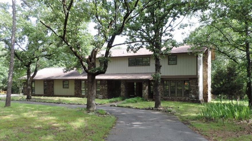 Close proximity to I-40 & Lake Beaverfork, fishing pond 100 yards from driveway, space & storage abound throughout, 4 large bedrooms, master suite w/sitting area and private deck, family room w/Buck wood stove insert, spacious formal dining room w/entrance to screened porch, heated & cooled workshop area, possible in-law quarters downstairs w/some modifications, sprinkler system, tons of cabinets & counterspace. Exterior & deck were painted this past year. (See agent remarks).