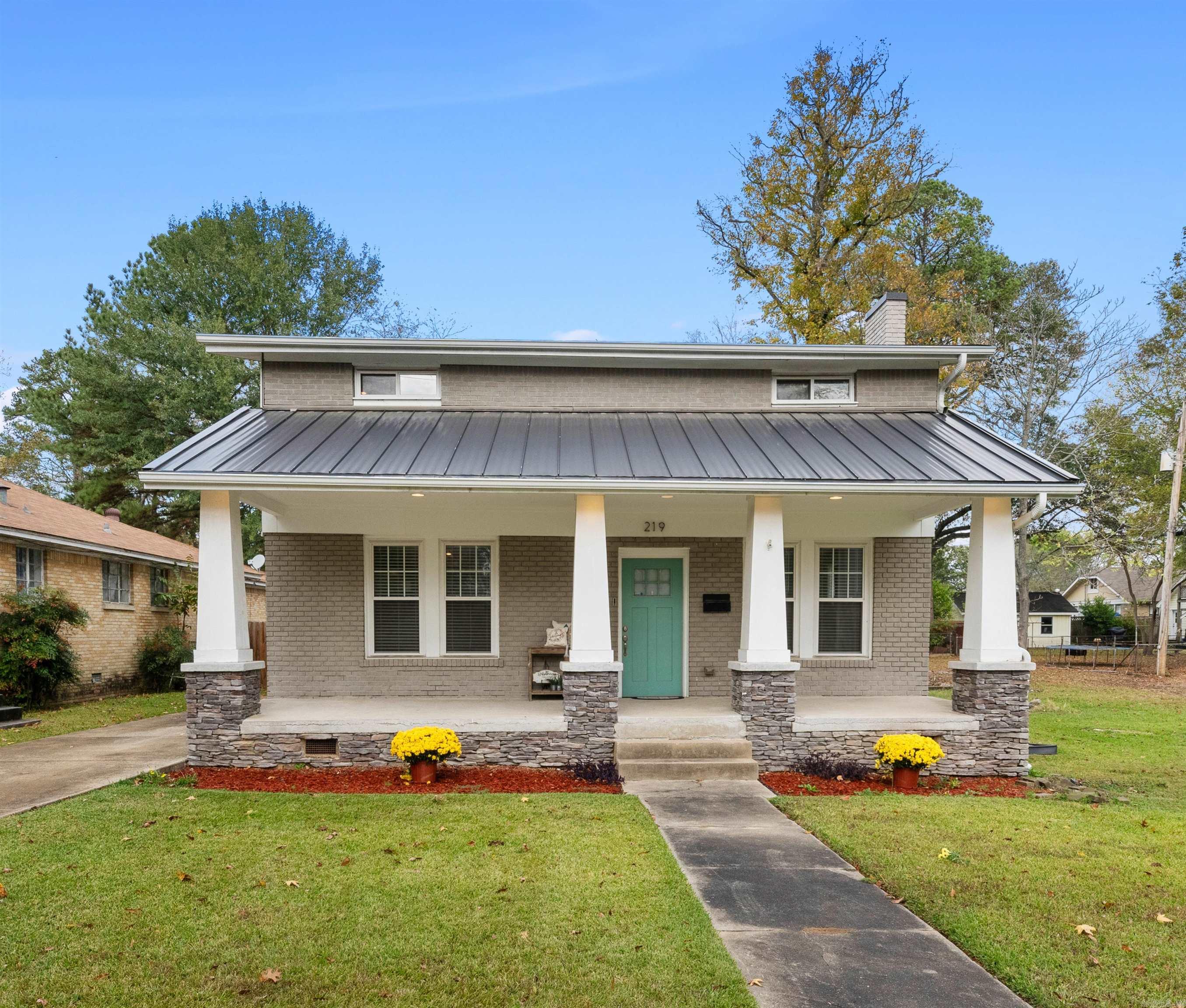 Historic Character Meets Modern Living with beautiful original hardwood floors, detailed molding, and an elegant updated Kitchen which features stainless steel appliances, granite countertops, and a large breakfast bar. Spacious Open Living Room, Dining Room and Kitchen in addition to a guest bedroom and full bath downstairs. Large windows bring in an abundance of natural light. Upstairs is the Primary Bedroom Suite with walk-in closet and a beautifully updated en-suite Bathroom with a large separate shower and a relaxing soaking tub. Second guest Bedroom upstairs is large with numerous windows and its own spacious bath and closet. The inviting Front Porch is the perfect place to enjoy a cup of coffee and take in the neighborhood’s historic charm. Down stairs off the Kitchen is the Laundry Room which leads to a back deck and a Detached 2 car Garage. Park Hill Historic District is close to everything. You are within walking distance to dining and within minutes to all that Central Arkansas has to offer. Entertainment such as Dickey Stephens Ball Park and Simmons Arena, or for work in Little Rock, the Little Rock Air Force Base, or travel from the Airport. Sq.Ft. approx. measure.