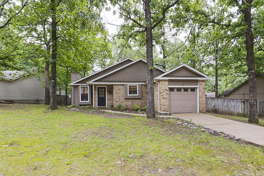 Welcome to this precious cottage nestled in Point West.This one-story home is a charming retreat that offers a perfect blend of comfort and convenience. Upon entering, you’ll love the open floorplan & soaring vaulted ceiling.The living area features a cozy fireplace with gas logs and flows seamlessly into a breakfast area which adjoins the pretty kitchen & breakfast bar (updates include new paint,light fixtures, countertops, & under cabinet lighting). This space is perfect for casual dining & opens up to a private deck, extending your living space outdoors.The home features 3 bedrooms & 2 full baths with new, low maintenance vinyl flooring & flat ceilings.The primary suit has a large walk-in closet & private bath. And both baths boast new vanities & sinks! Outside, you'll find a fenced backyard, offering privacy and space for outdoor activities or pets. The deck is a great spot for barbecues or simply enjoying a cup of coffee in the morning. And the home also has a one-car garage for convenient parking. This home is just a stone's throw away from shopping & restaurants , and the level lot adds ease of maintenance for a lifestyle of comfort & convenience!*SEE REMARKS*