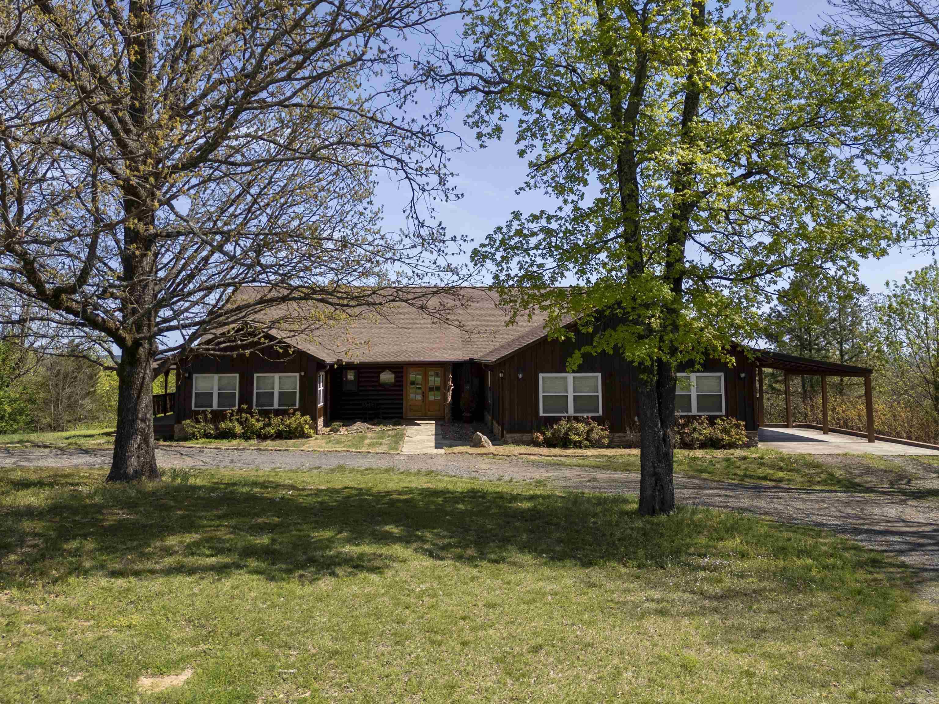 Escape to your private retreat with this breathtaking 4,200 sq. ft. cabin nestled on 16.11 gated acres of serene countryside. Offering unparalleled panoramic views of the valley, this property is a perfect blend of rustic charm and modern comfort with wrap around porches overlooking the fabulous valley view. Inside, you’ll find 4 spacious bedrooms, 4 baths, and two inviting living areas, ideal for entertaining or cozy evenings by the fire. A guest quarters is also present with a mini kitchen, living room, bedroom & full bath. The open-concept design showcases warm wood finishes, soaring ceilings, and expansive windows that bring the beauty of nature indoors. Step outside and embrace the great outdoors—whether it’s fishing in the private pond, watching abundant wildlife roam, or utilizing the large barn for storage, livestock, or hobbies. With a secure gated entrance, privacy and tranquility are yours to enjoy. This one-of-a-kind property offers the perfect balance of seclusion and convenience—ideal for a full-time residence, vacation getaway, or investment retreat. Don’t miss out on this incredible mountain escape! Schedule your private showing today.