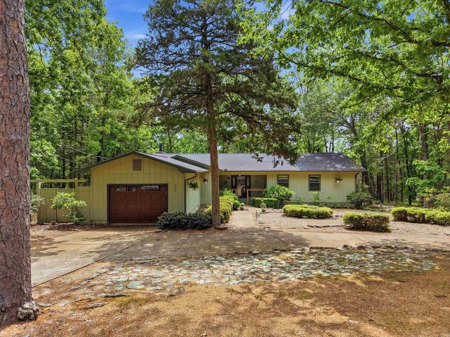 Welcome to your peaceful retreat in beautiful Fairfield Bay! Nestled among the trees on a quiet street, this beautifully updated home sits on over an acre and offers privacy with easy access to outdoor recreation—just minutes from Tee Pee boat launch and Greers Ferry Lake. Inside, you’ll find tasteful updates including granite countertops, newer appliances, high-end refrigerator, updated flooring, and refreshed bathrooms. The spacious layout features large walk-in closets, a cozy stone fireplace, and a heated and cooled sunroom overlooking the wooded backdrop. Enjoy outdoor living with a screened-in porch, perfect for entertaining. A fenced area is ideal for pets, plus a storage building adds convenience. With a new roof in 2022 and numerous updates throughout, including a new insulated garage overhead door. This move-in-ready home is perfect as a full-time residence or weekend getaway in one of Arkansas’s premier lake communities. Residents enjoy golf, hiking, biking trails, atv/utv trails, marina access, and resort-style amenities Fairfield Bay is known for, making this a true escape with everyday comfort. Option to purchase some furnishings. See Agent remarks for updates.