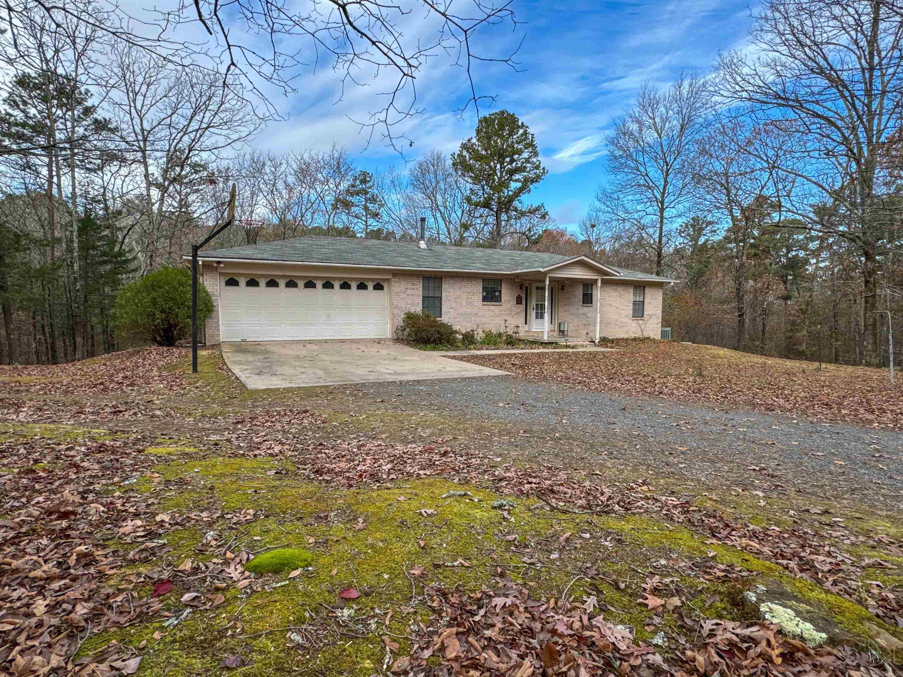 Come check out this beautiful brick home set off the road back in the trees. You'll have plenty of room in this 3 bedroom, 2 bath house. This house has a nice sized kitchen, dining room, and living room as well as a large den in the basement. You can relax on a large screened in back porch in the summer and enjoy the cozy warmth of the den's large wood stove in the winter. A nice shop is right out your front door with room to work on all your projects and a place to store your boat. This place is less than 5 miles from the Cove Creek Park boat launch on Greers Ferry Lake. The property itself has over 20 acres of hardwood timber with a small creek running through it and is loaded with wild game. This amazing property shouldn't last long on the market so look at it today!