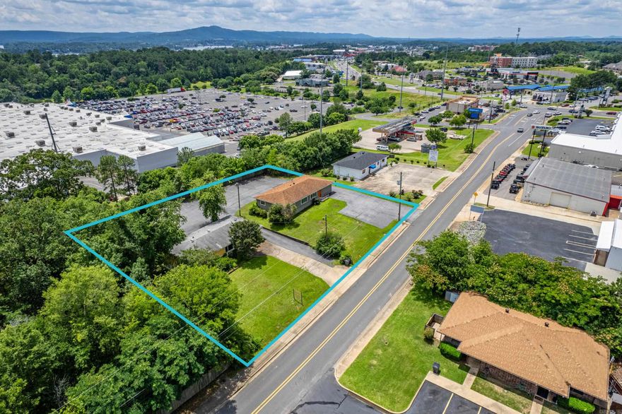 Situated at the side of the largest and busiest Wal-Mart in Hot Springs, and within two blocks of Central Avenue, 114 Buena Vista is zoned Commercial/Residential and 116 is zoned Commercial.  The HS Bus Line stops at the nearby corner.  Seller has had a lifelong dental practice at 116 Buena Vista and is retiring at the end of June.  These buildings could be converted to homes and used for rental, otherwise, a great location for office space, or cleared for construction of new.