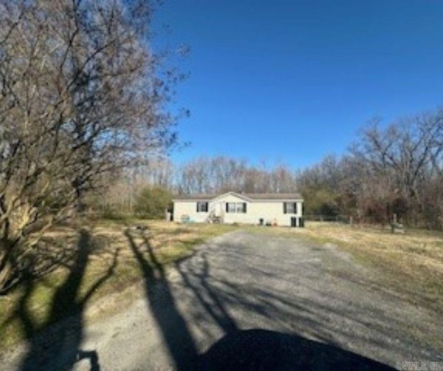 This investment property has an open floorplan with 4 bedrooms and 2 baths. The primary is separated from the secondary bedrooms. The home is located on two acres. Being sold as is. Flood insurance is needed if buyer has a loan.