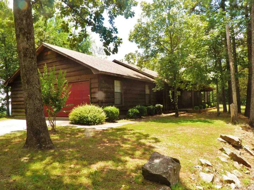 Wonderful hill top home over looking Lake Conway in beautiful Pine Village subdivision.  Split floor plan, spacious open living, master suite w/jetted tub & shower.  Large windows to take in the views.  2 level decks for awesome outdoor living.  Huge garage.  RD financing eligible.