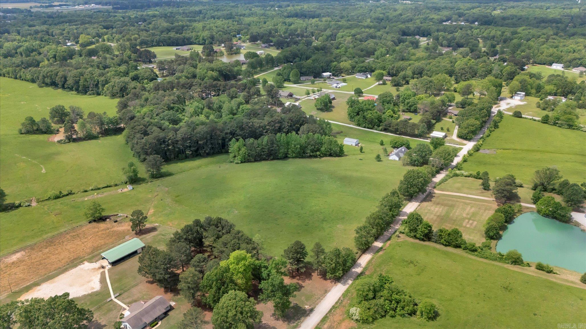 Beautiful 111-acre property located in Jonesboro, Arkansas, nestled between County Road 348 and County Road 342. This rare offering includes three separate tracts: Tract 1 (9.2 acres), Tract 2 (7.73 acres), and Tract 3 (94.38 acres) all featuring gently rolling hills, rich green pastureland, and scattered shade trees throughout. The land is fully fenced and includes two established cattle ponds, making it ideal for livestock, hay production, or recreational use. With wide-open views, abundant wildlife, and peaceful country surroundings, this property offers the perfect setting to build your dream home or develop a private estate. Enjoy the quiet of rural living while still being just minutes from the amenities of town.