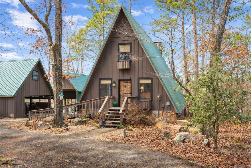 When you think "Lake-House", A-Frames are a nostalgic design that comes to mind.This A-Frame is so cozy, has a wood burning fireplace, LAKEFRONT (with White Line in the water, so more trees can be cut to open the view up even more), Lake Views from the cabin & decks, plus steps down to the water. For many years the cabin has been setup to be used as a 3 bedroom (1 Bedroom upstairs above the kitchen w/full bathroom on main level, Primary bedroom downstairs w/a full bathroom & laundry room connected, & 3rd bedroom setup downstairs as well w/walk-out basement onto the lower patio. There is a large room above carport that would make a great Bunkroom/gameroom/craftroom/guest quarters,etc. The home was built in 1988, but Remodeled w/all new LVP flooring throughout the home around 2021,new roof/gutters in 2018,pull blinds installed May 2024,all new kitchen appliances, countertops & cabinets in July 2024, & High-Speed Internet through "Connect 2 First".  Community Boat Ramp & Private Airstrip for property owners in "Skypoint Estates". Option to purchase extra lot across the street for additional $15,000 (Lot 18). See Virtual Tour Website to view videos, Floorplans, & see docs attached.