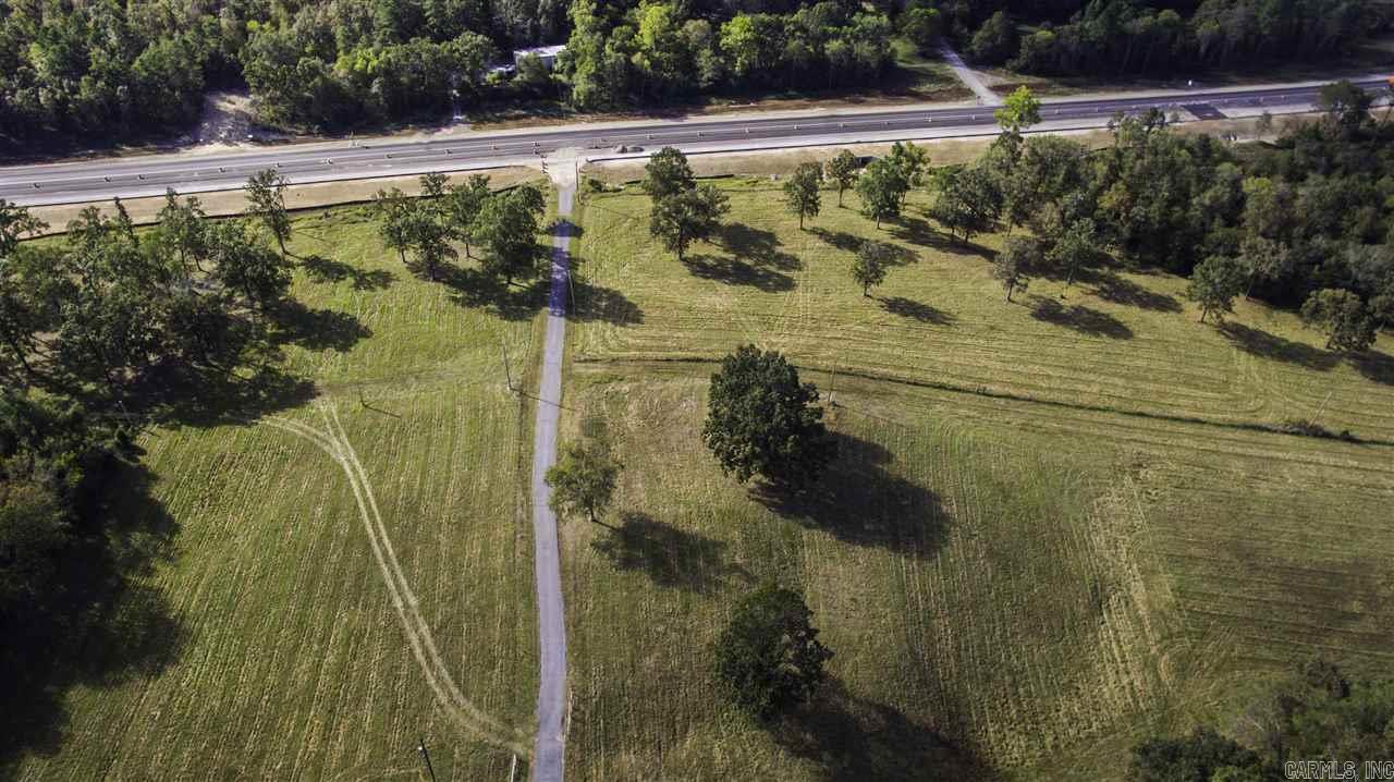 WHAT A GREAT PROPERTY WITH ALMOST 1/2 MILE OF HIGHWAY 70 FRONTAGE(WHICH IS BEING EXPANDED TO 5 LANES),LOCATED TWO MILES FROM THE INTERSTATE (I-30),GIVES THIS PROPERTY GREAT OPPORTUNITY FOR COMMERCIAL DEVELOPMENT.THIS PROPERTY ALSO HAS ROLLING HILLS WITH SCENIC VIEWS OF SURROUNDING MOUNTAINS THAT ARE SPECTACULAR,A PAVED ROAD THROUGH THE MAJORITY OF THE PROPERTY, CROSSED FENCED FOR CATTLE, WATER AND ELECTRICITY TO 3 SEPARATE BARNS,TWO PONDS,BORDERS SOUTH FORK SALINE RIVER AND ALUM FORK AND HAS RIVER FRONTAGE.