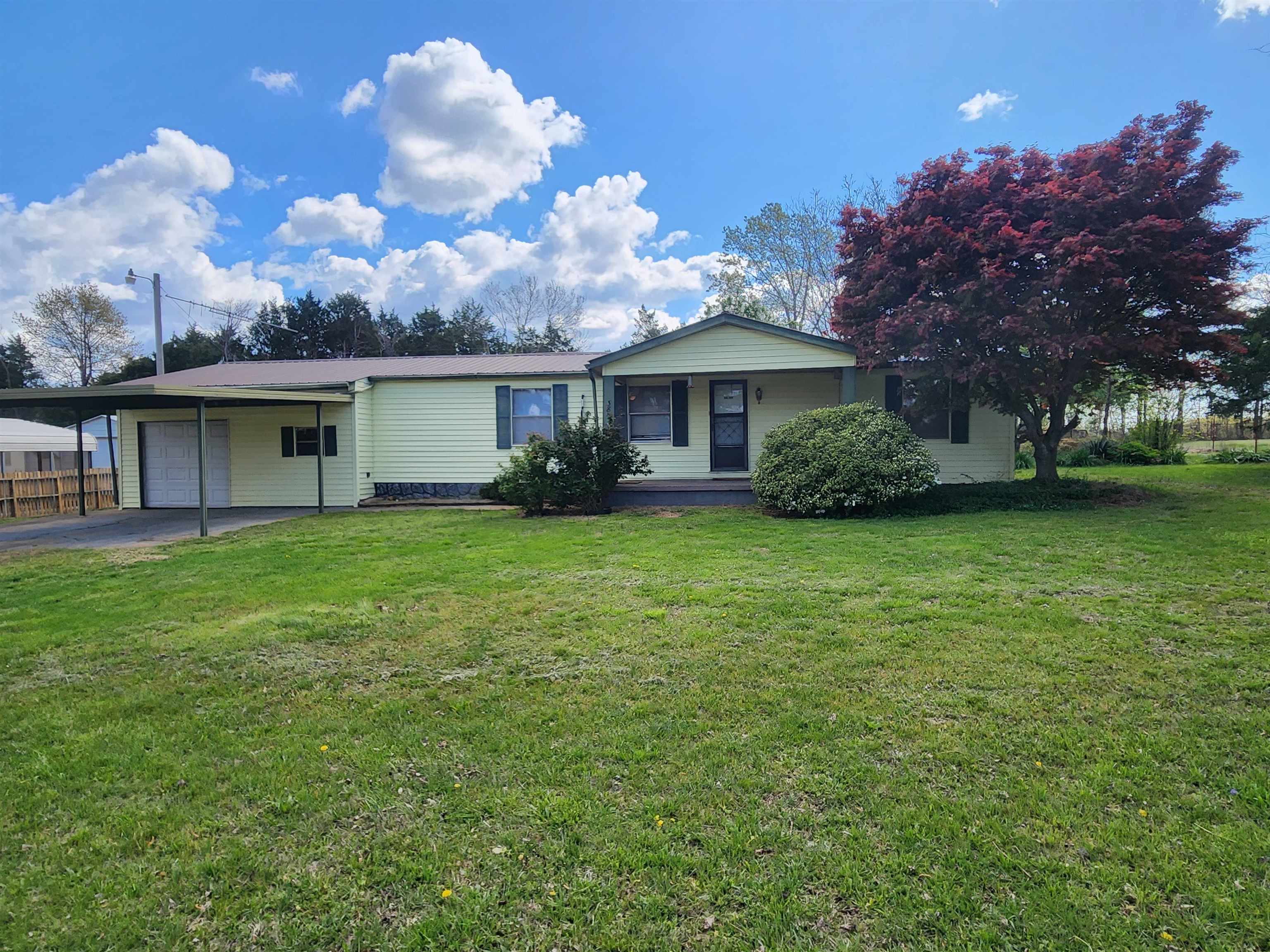 Exceptional Deal!!! This wonderful 3-Bedroom 2-Bathroom home can be a fantastic starter home, vacation home or even a retirement home. It is located a little over 3 miles outside of Ash Flat, Arkansas. In the country, but close enough to town to have quick access to shopping, dining and entertainment. Make an appointment to come see this home with a large family room with a brand new mini-split HVAC, Kitchen with a huge walk-in pantry. The primary bedroom has a large walk-in closet and its own bathroom all with new flooring. There is an attached garage and shop with a roll up door and an attached carport. There is also a detached garage/shop and carport. Storm Shelter already on site for your peace of mind. Don't forget about the wonderful added on sunroom where you can spend time watching sunrises and sunsets. Or have coffee and watch nature around you with all the fruit trees, apple, pear, etc. and shrubs and flowers. With just a little TLC the detached shop could be a great she-shed, man cave or hobby shop. All this sits on roughly a 1/2-acre M/L of flat level land. Make an appointment to see this one before it is gone. This home and property is being sold AS-IS.