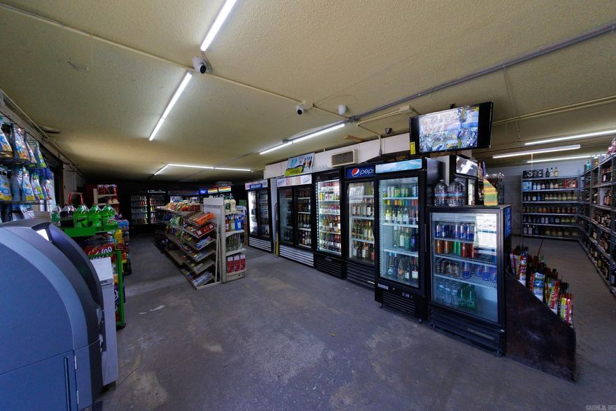 Attention entrepreneurs and investors: Seize this chance! INCOME IS GROSS REVENUE WITHOUT EXPENSES AND COST OF GOODS. OWNER WILL PROVIDE FINANCIALS WITH A SIGNED NON-DISCLOSURE AGREEMENT. An established liquor store is currently on the market as the current owners are planning to retire. They are offering a lucrative package, including the business itself, the building (2700 Sq Ft with potential for a drive-thru window), and land. The deal encompasses essential equipment such as the cash register, coolers, displays, surveillance tools, and an ATM machine. With an established clientele and considerable growth potential, this opportunity is not to be overlooked. Additionally, the available land provides space for a restaurant or another business adjacent to the liquor store. Situated in the county beyond city limits, the property is subject to fewer regulations, making it an even more attractive prospect. Inventory shall be purchased by the buyer at cost plus 10%.