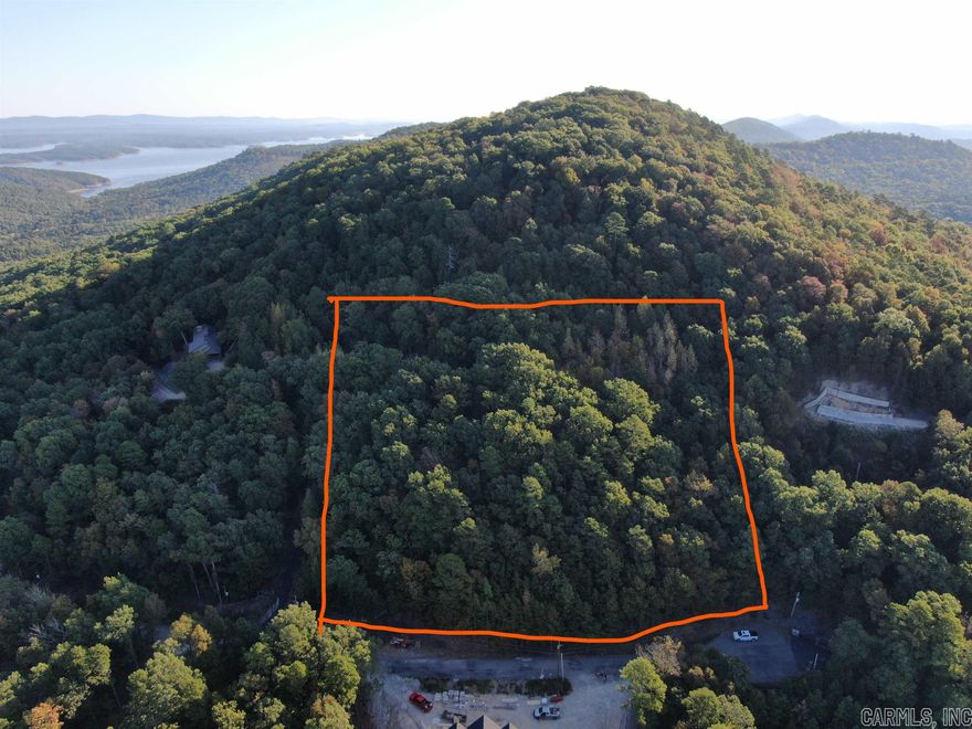 Enjoy your OWN beautiful mountain with unbelievable views in every direction! Be on top of the world with 2.62 acres at the end of the cul-de-sac. Your property backs right up to the Ouachita National Forest where you can catch the Vista Trail and hike or bike to your desire! Get out of your car and walk up to see for yourself...you can build your dream home, play on the lake all day then relax with nice breezes and breathtaking views. Incredible homes are being built all around Harbor South