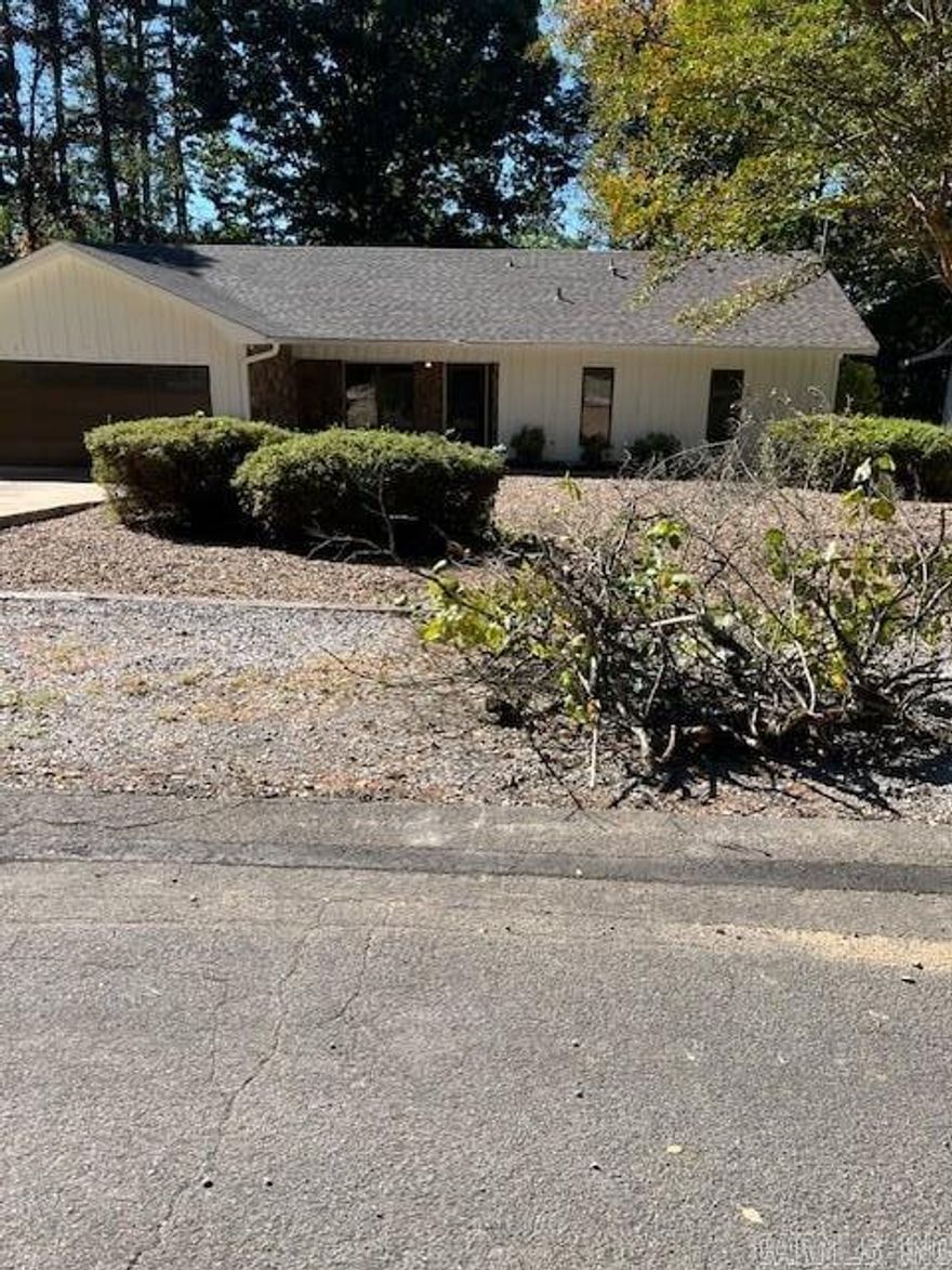 Peaceful Living in Hot Springs Village – Your Forever Home! Nestled in the tranquil, gated community of Hot Springs Village, this 3-bedroom, 2-bath Ranch home offers the perfect opportunity to create your ideal retirement retreat. This home is move in ready, with a new roof, fresh paint, renovated kitchen with stainless appliances and updated bathrooms. The new owner has the privilege of living seconds from eateries, dollar stores, banks and gas stations. There is a community swimming pool, golf course, put put, and tennis court in the community as well as basketball courts.  There are bike trails and a marina as well as a club house and around 24 hour security. As a retiree:  Whether you're downsizing or looking for a low-maintenance lifestyle in a serene setting, this property has been fully updated. Move right in and start living the fully retired life with the world at your finger tips.