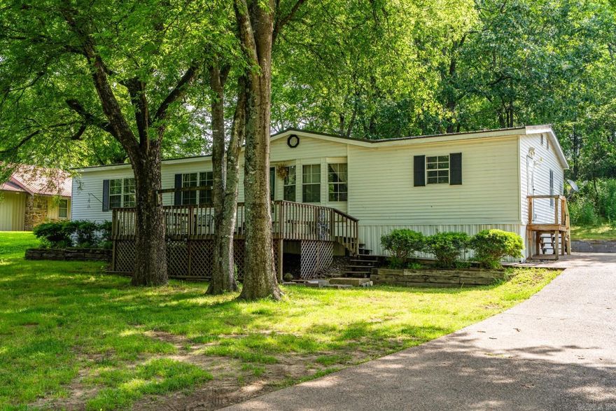 Family-Friendly 3 Bed, 2 Bath Home on 0.60 Acres – Great Location!  Spacious and comfortable, this 3-bedroom, 2-bath mobile home sits on a large 0.60-acre lot in the Cutter Morning Star School District. Plenty of room inside and out for kids to play and families to grow.  Just minutes from downtown Hot Springs, you’ll enjoy the quiet of country living with city convenience close by. A great place to call home!  With tons of space to spread out, it's perfect for backyard fun, pets, or even a future garden. Move-in ready and waiting for your family’s next chapter!