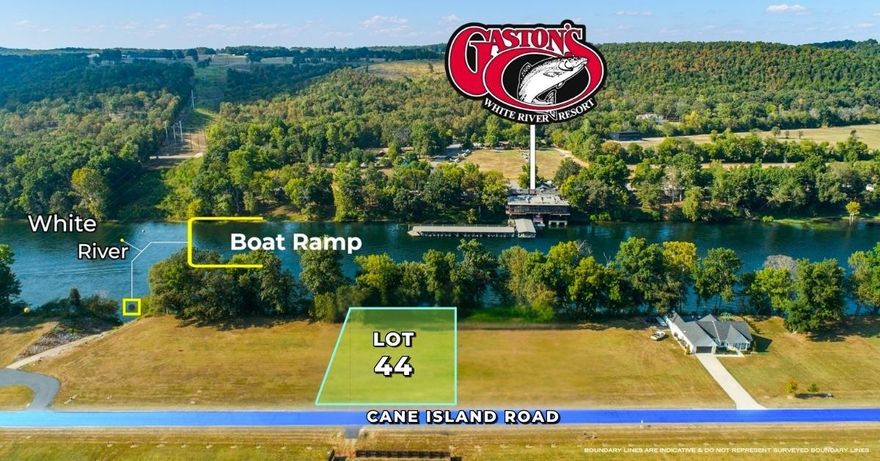 Cane Island Estates—a gated sanctuary nestled along the pristine banks of the White River. Rare opportunity to own Lot 44, a .64+/- acre of riverfront elegance, perfectly positioned across from the world-renowned Gaston’s Resort and Restaurant. Boundary shown not a survey. Design your dream home where the land gently slopes to the water’s edge and every sunrise reflects off the river like a painting. With city water, underground utilities, fiber optic internet, and a private boat ramp just steps away, this property blends modern convenience with timeless natural beauty. Wake up to the sound of flowing water and cast a line from your backyard into some of the best trout fishing in the country. Whether you're boating, hiking, or simply relaxing in a hammock, Cane Island offers serenity and adventure in equal measure. This is not just land—it’s a canvas for your vision. Cane Island Estates is one of the most stunning developments in all of Arkansas, with manicured grounds, protective covenants, and a community designed for those who value privacy, prestige, and nature’s finest backdrop. 110 feet of river frontage. High elevation.