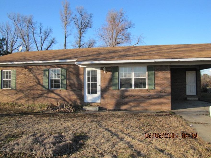Solid brick house on a quiet street in Corning would be a great starter home with some TLC. Three bedrooms and one full bath. Central heat and air. Dining area has sliding glass doors that open to a large enclosed patio. Yard is extra large on the 172ft. deep lot. Covered parking and extra storage room in carport.